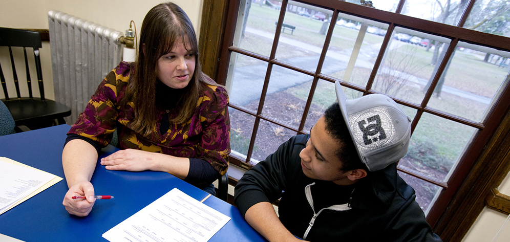 student working with advisor