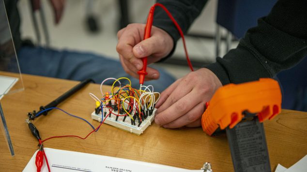 Student working in an electrical engineering technology lab