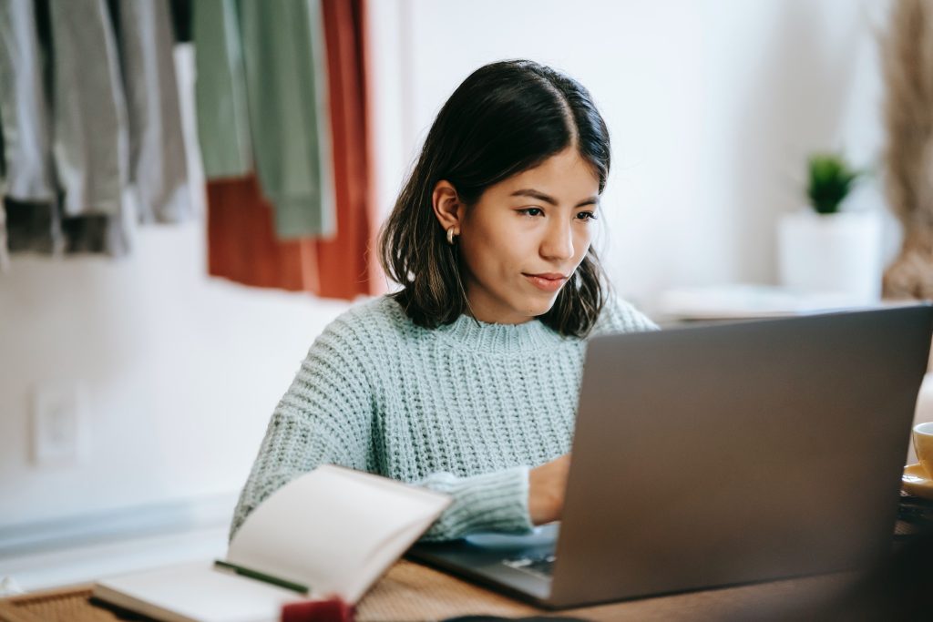 A stock image of a woman on a computer