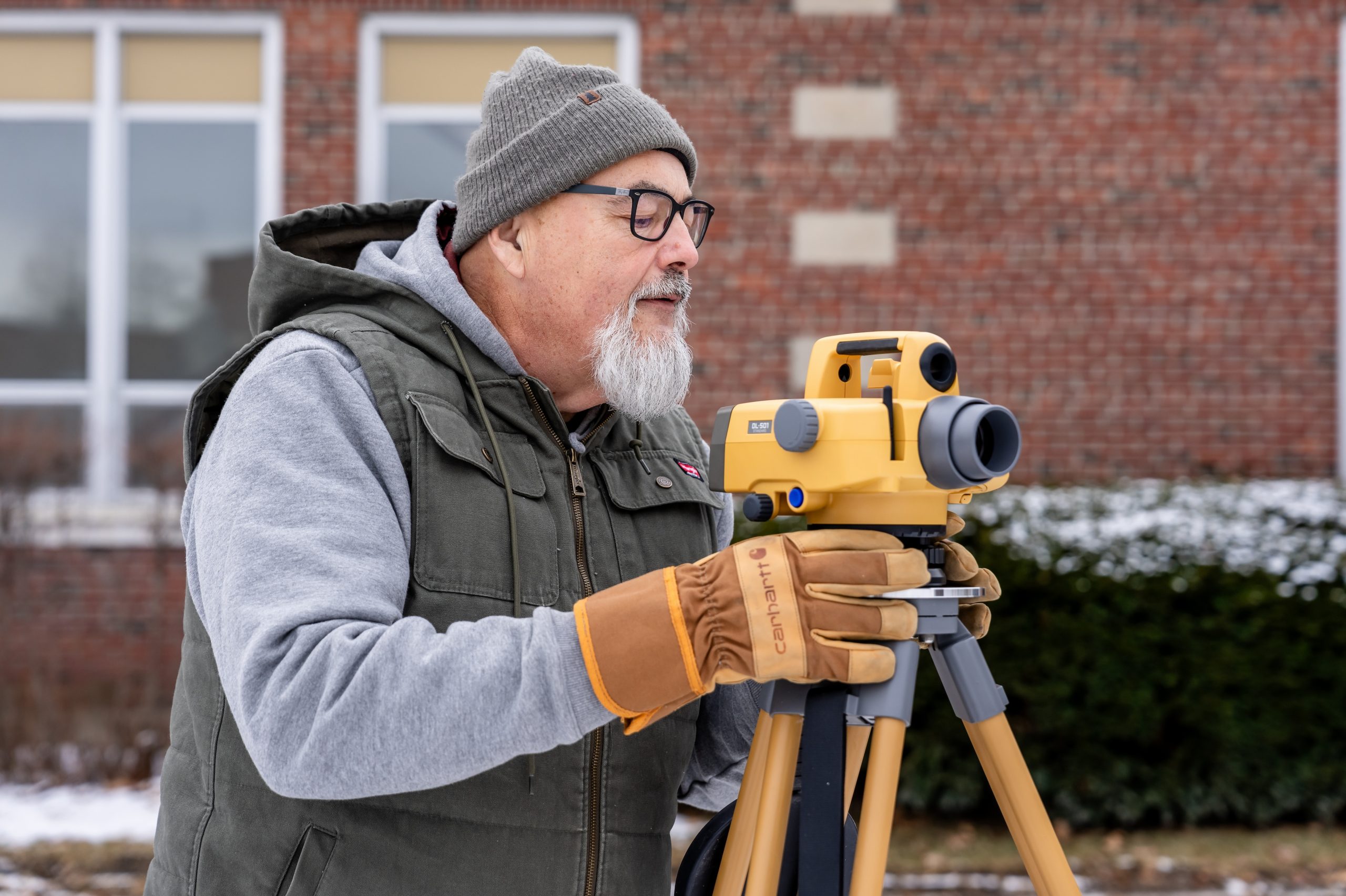 Person using surveying equipment