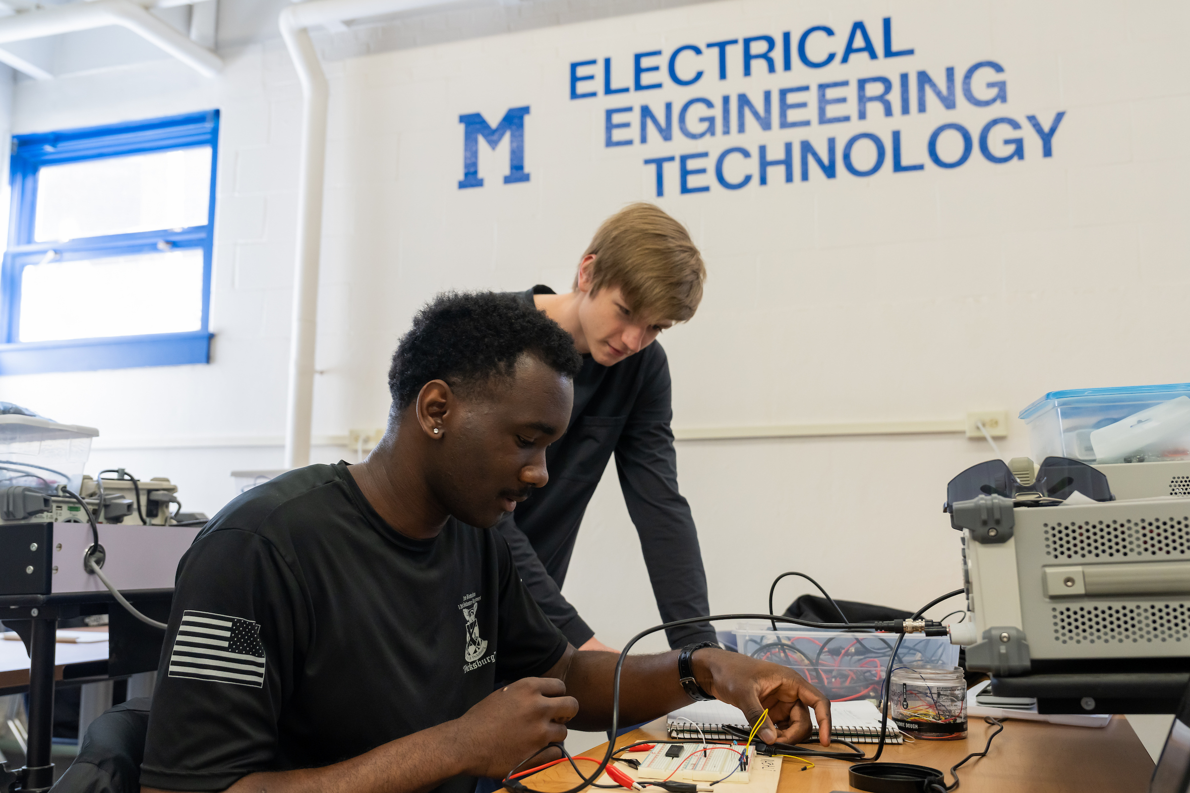 Student working in an electrical engineering technology lab