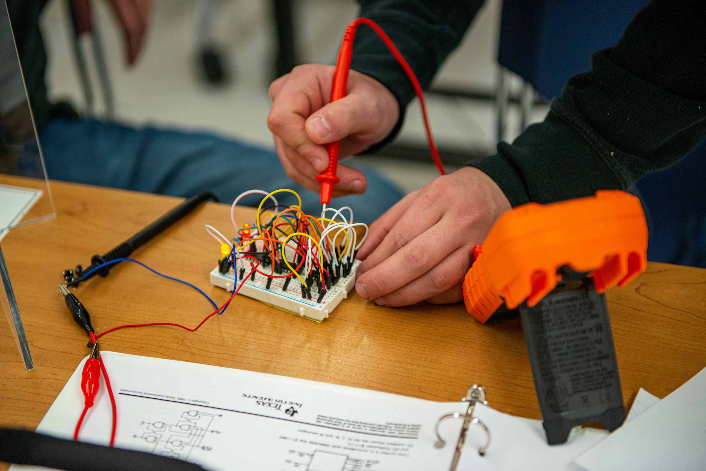 Student working in an electrical engineering technology lab