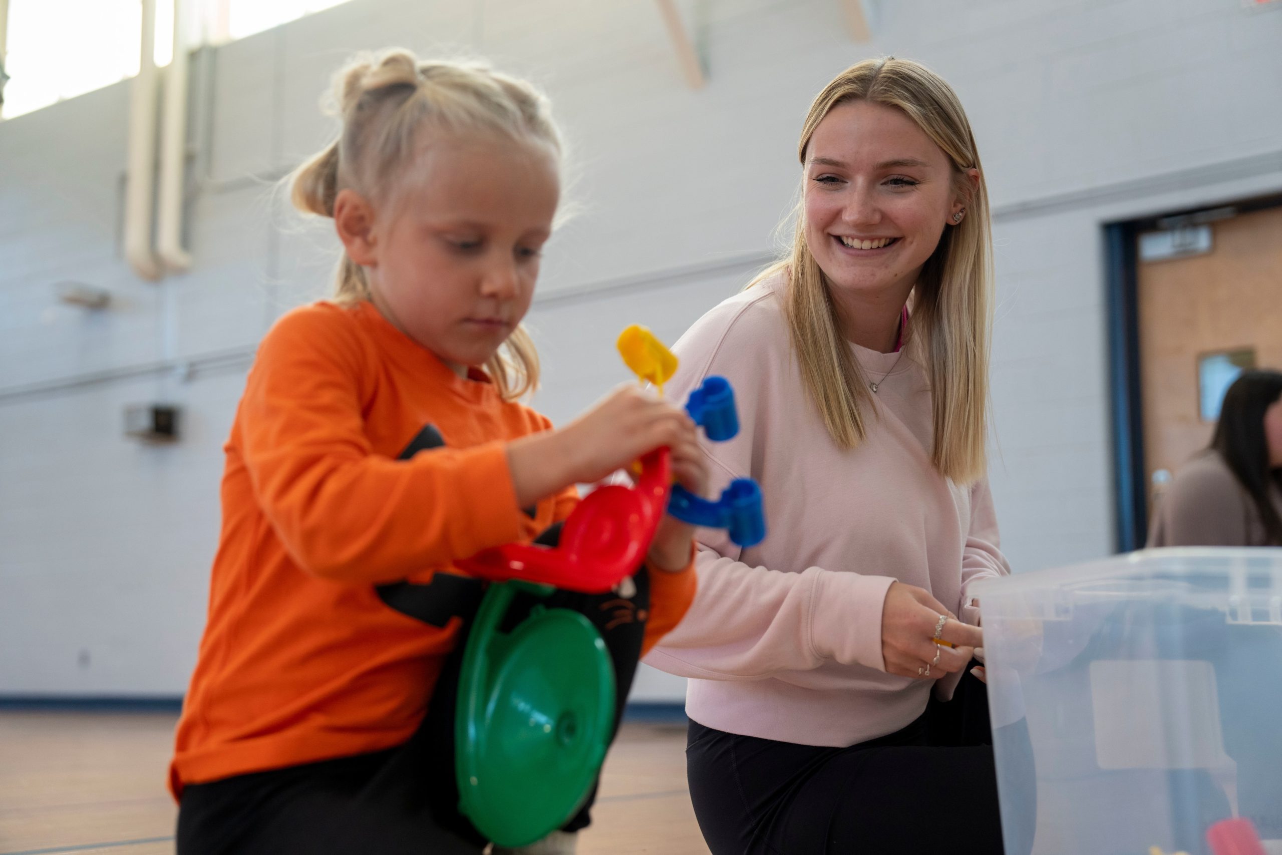 Teacher playing with young student