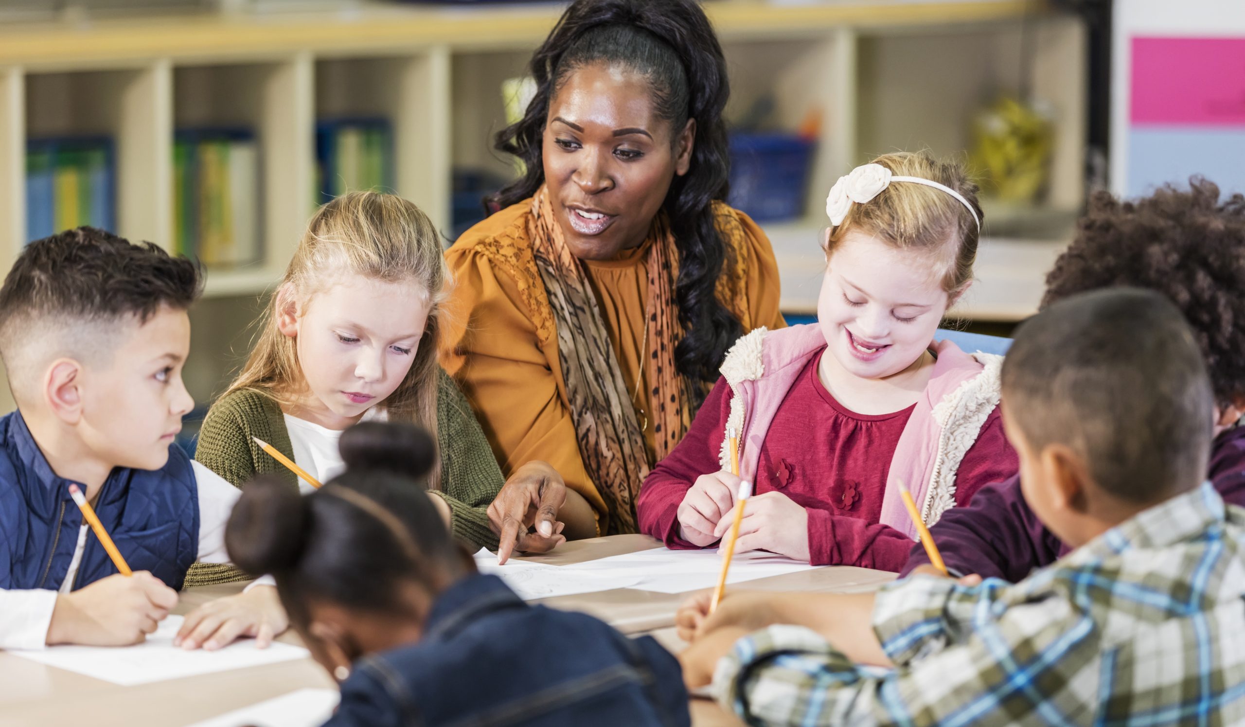 Teacher working with students with disabilities