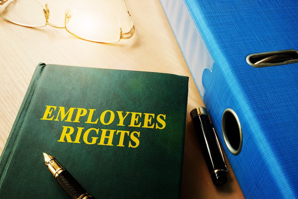 Book with title of Employees Rights on a table