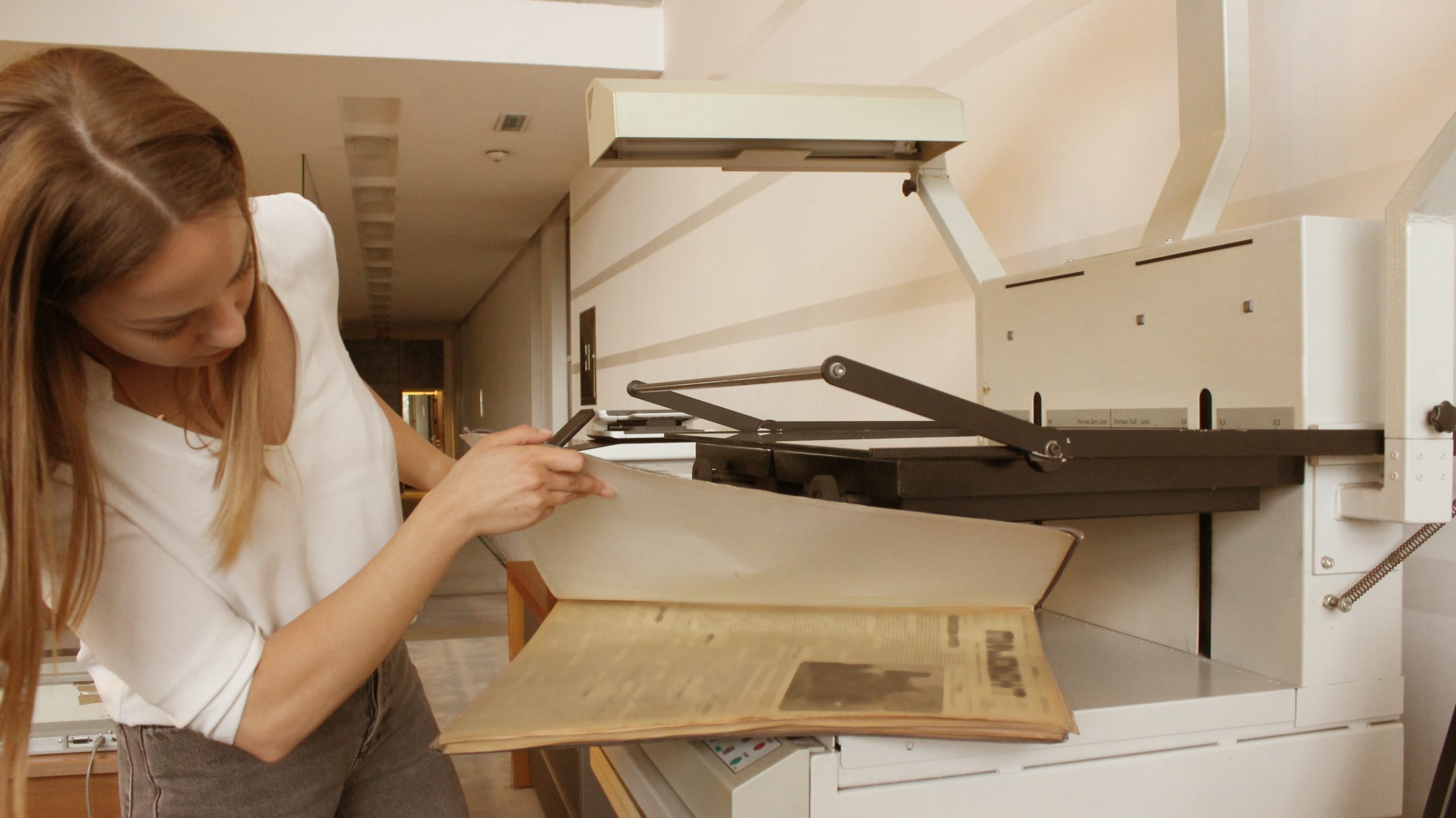 Librarian scanning documents.