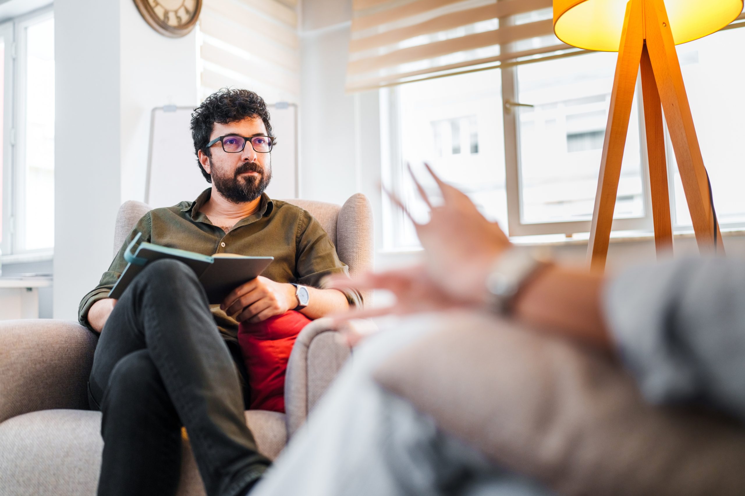 Therapist talking to a client