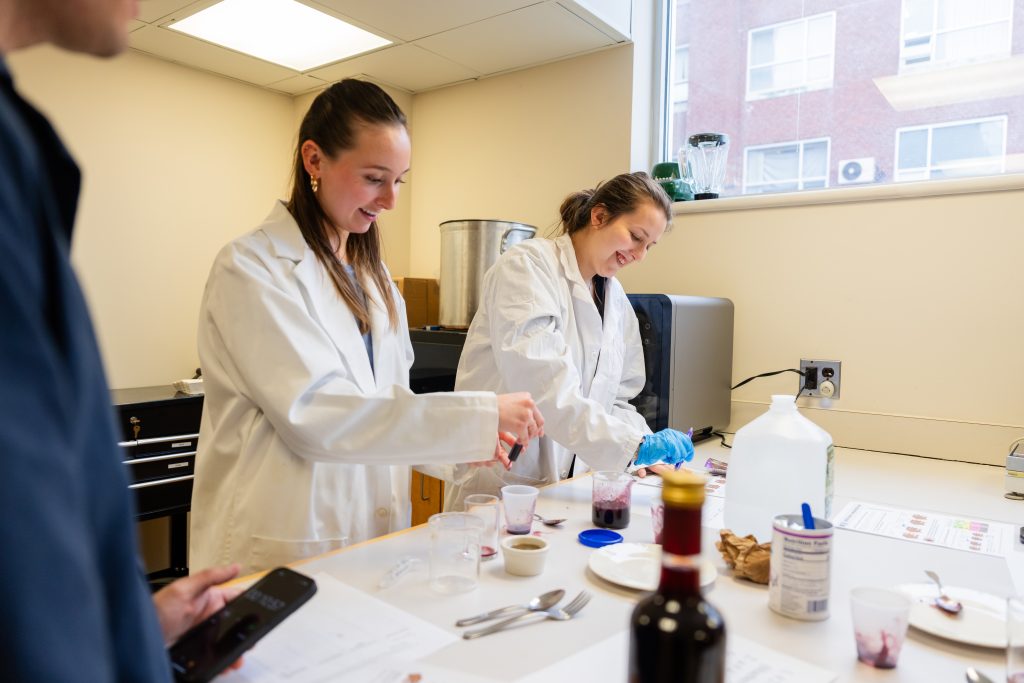 Two students working in a food lab