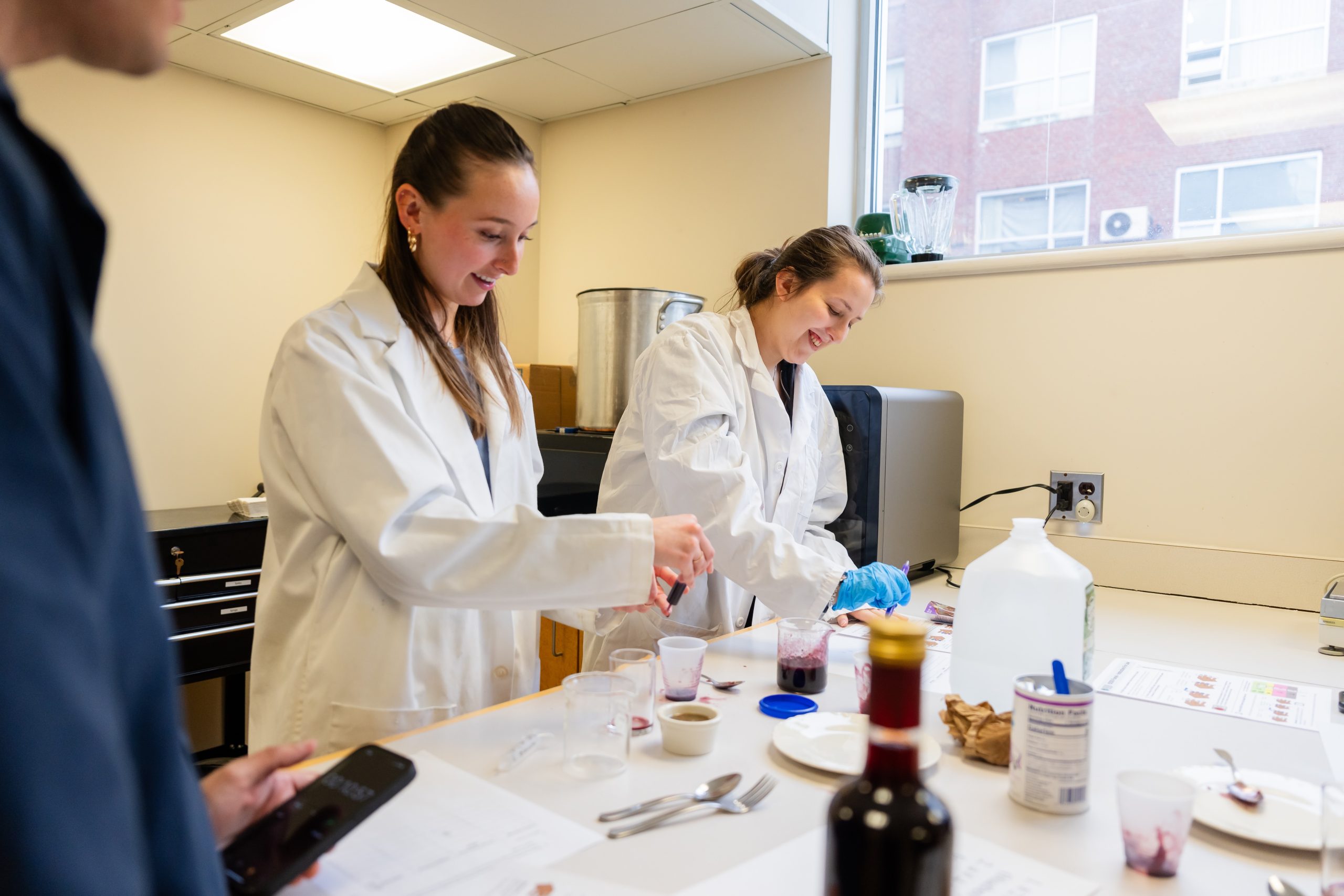 Two students working in a food lab